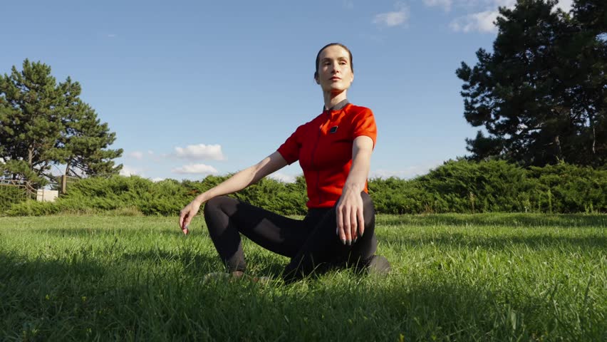 Stretching exercises in a sunny park