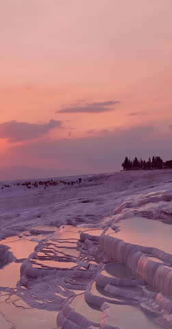 Pamukkale's Travertine Terraces Reflect the Golden Hues of a Serene Sunset in Turkey