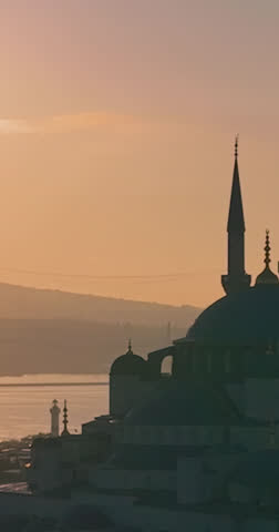 Iconic Istanbul Mosque Silhouette at Golden Sunrise Over the Bosphorus Strait in Turkey