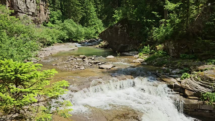 Small waterfall on Torrente Travignolo in Italian Dolomites.