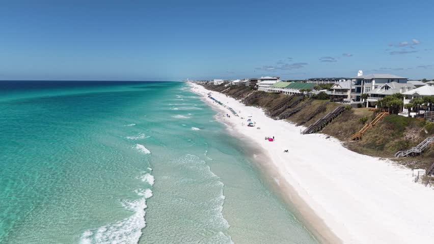 Aerial coastline view of white Alys Beach with emerald ocean water and seaside houses, Panama City, Florida, USA