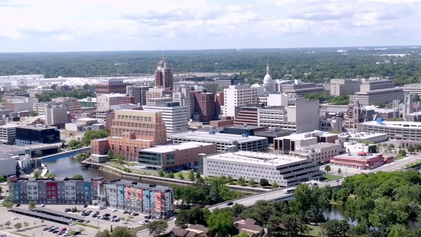 Downtown Lansing, Michigan with drone video parallax moving in.