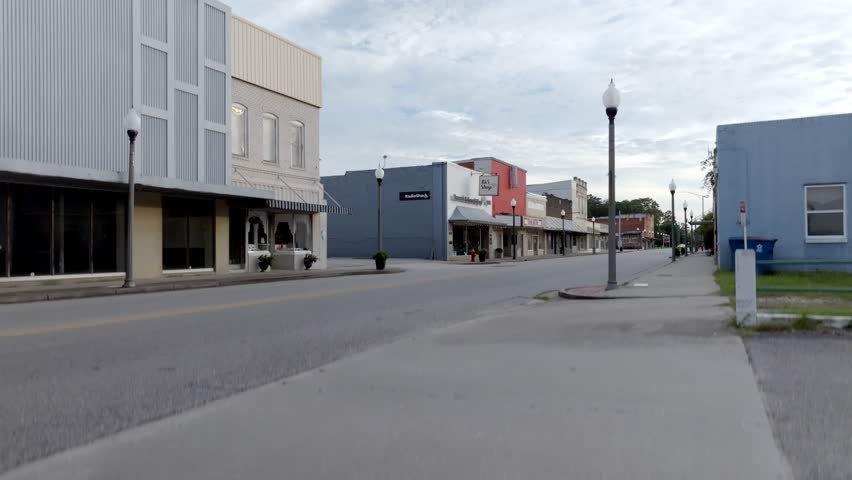 Jackson, Alabama downtown with drone video moving up.