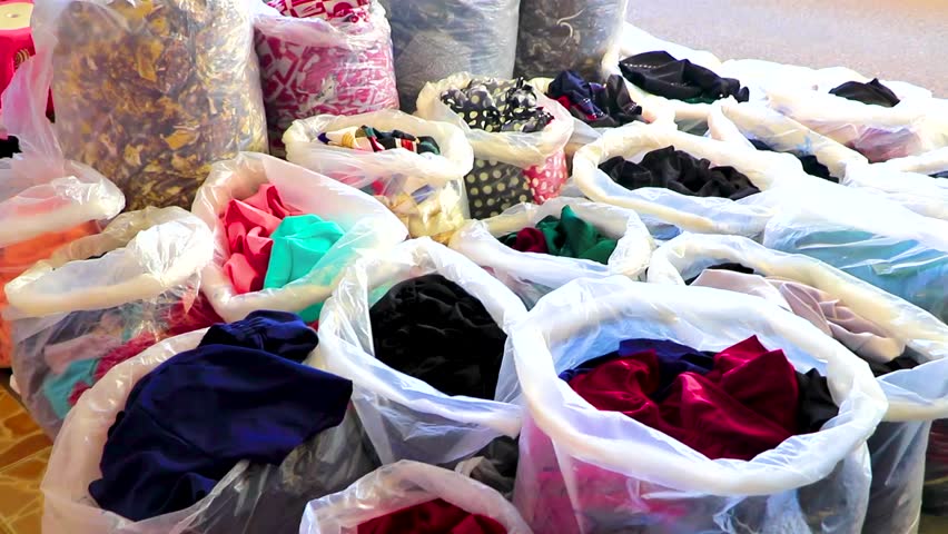 Clothes tourist fabric souvenir shop store at the Pratunam Wholesale Market in Khon Kaen District Khon Kaen Province Isan Northeast Thailand in Southeast Asia.