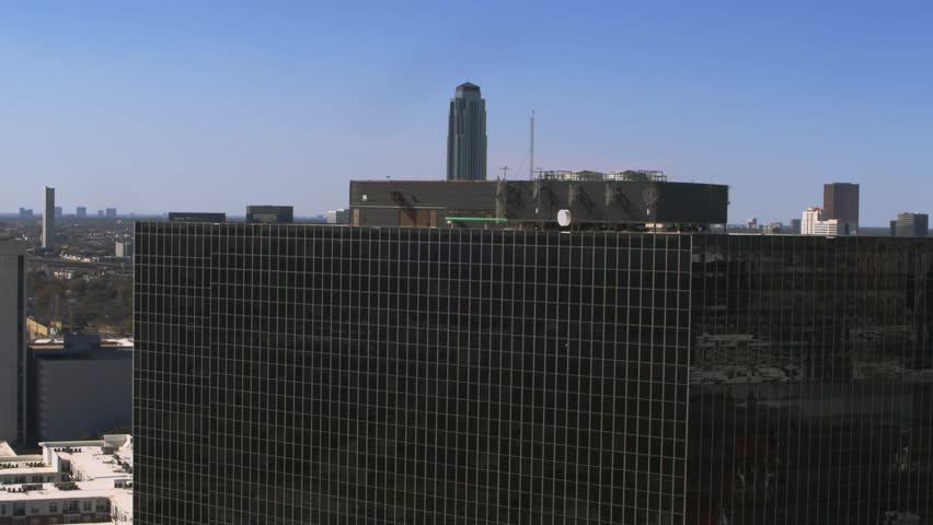 Establishing drone footage of a commercial office building in Greenway Plaza, Houston. Ideal establish
