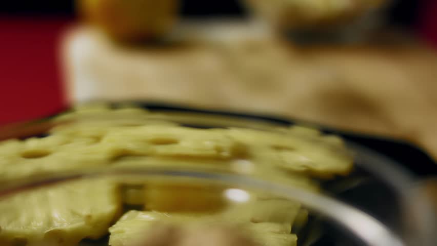 A slice of pineapple is cut into small pieces