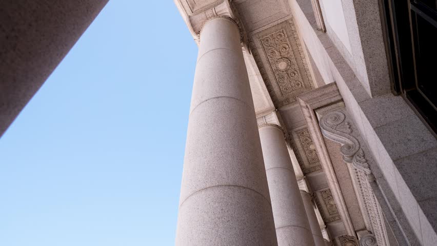 View the columns of the Minnesota State Capitol as they symbolize the balance of law and the judicial system in Saint Paul