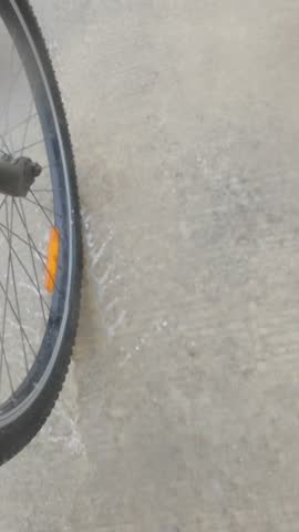 Bicycle Wheel Splashing Through Water