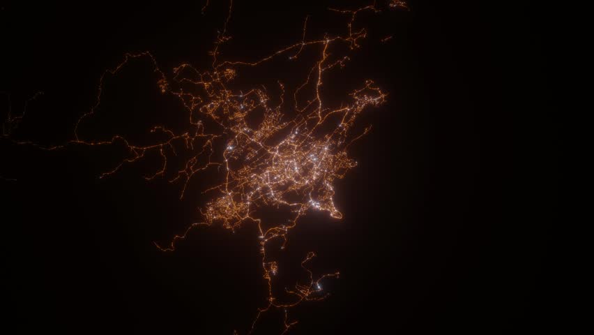 Port Moresby (Papua New Guinea) top view at night. View on modern city from satellite. Camera is zooming in, rotating counterclockwise. Vertical video. The north is on the left side