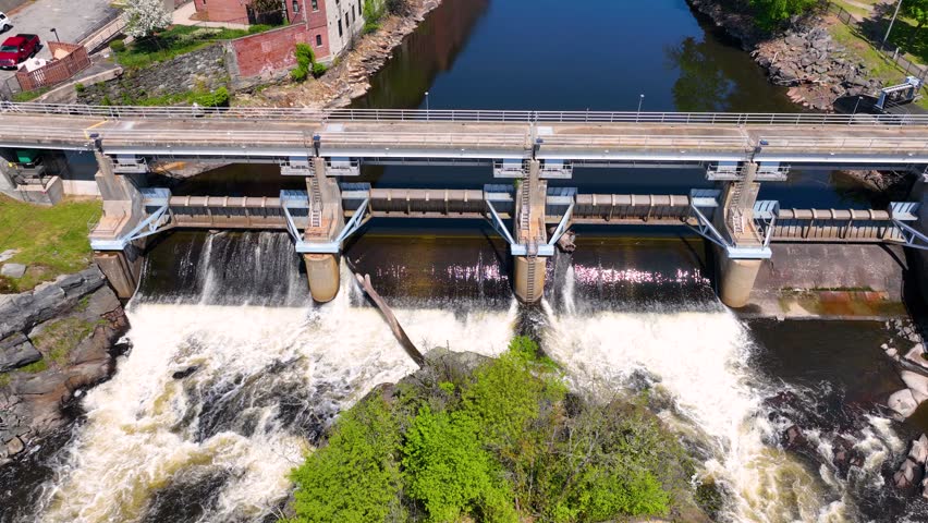 Woonsocket Falls Dam and Glenark Mills building on Blackstone River aerial view in downtown Woonsocket, Rhode Island RI, USA.