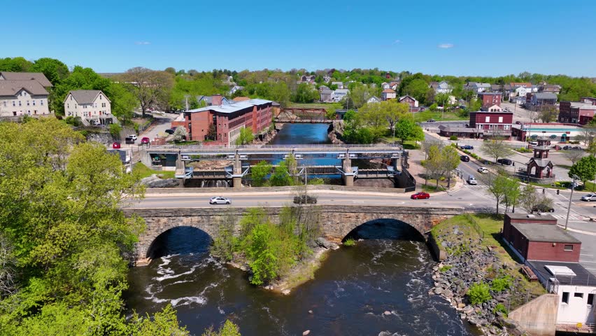 Main Street Bridge and Woonsocket Falls Dam on Blackstone River aerial view in downtown Woonsocket, Rhode Island RI, USA.