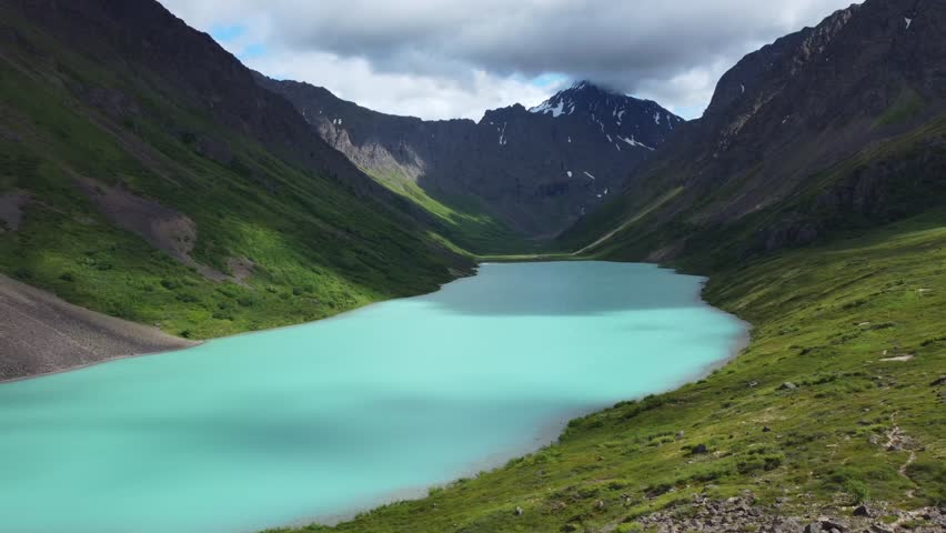 Spectacular drone footage of turquoise blue water of Eagle lake in Chugach National forest in Alaska, Beautiful scenery with lake and mountains