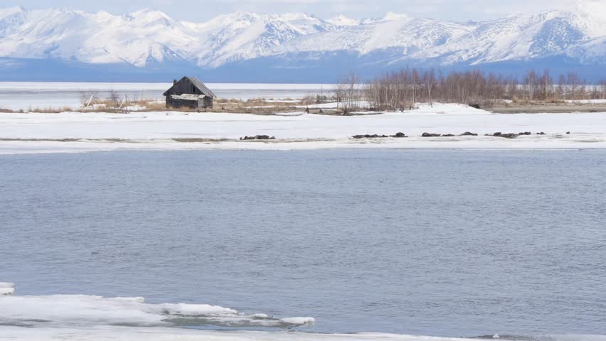 The icy shore of Lake Baikal in Russian Siberia in late spring. The northernmost point of Lake Baikal is located in the small town of Nizhneangarsk.
