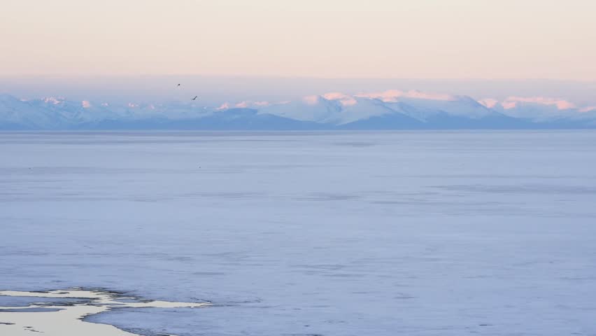 The icy shore of Lake Baikal in Russian Siberia in late spring. The northernmost point of Lake Baikal is located in the small town of Nizhneangarsk.
