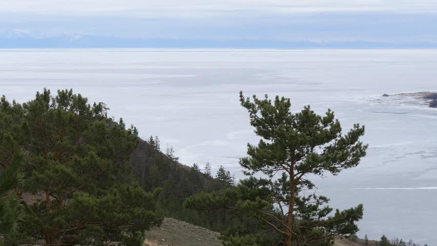 The icy shore of Lake Baikal in Russian Siberia in late spring. The northernmost point of Lake Baikal is located in the small town of Nizhneangarsk.
