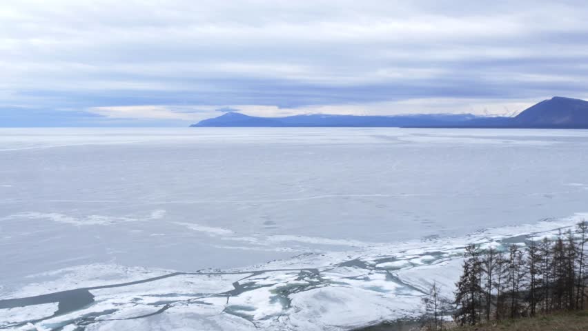 The icy shore of Lake Baikal in Russian Siberia in late spring. The northernmost point of Lake Baikal is located in the small town of Nizhneangarsk.
