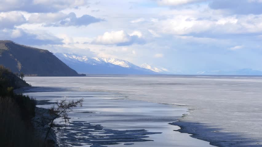 The icy shore of Lake Baikal in Russian Siberia in late spring. The northernmost point of Lake Baikal is located in the small town of Nizhneangarsk.
