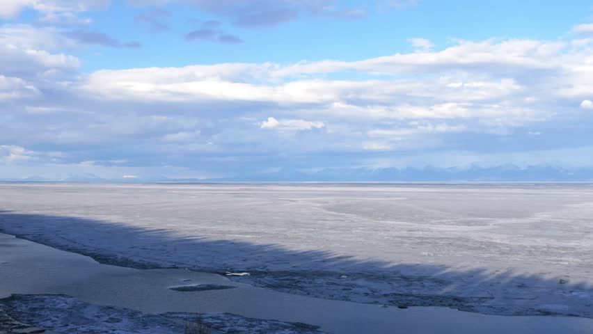 The icy shore of Lake Baikal in Russian Siberia in late spring. The northernmost point of Lake Baikal is located in the small town of Nizhneangarsk.
