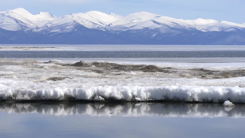 The icy shore of Lake Baikal in Russian Siberia in late spring. The northernmost point of Lake Baikal is located in the small town of Nizhneangarsk.
