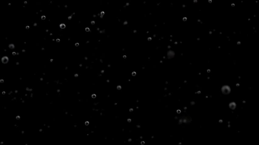 Very fine and sparse white dust particles spread across deep black background 