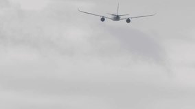 Back view of a commercial airliner climbing into the cloudy sky after takeoff. Symbolic image of aviation, travel, and freedom - Powered by Shutterstock - Get 15% off with code: PIKWIZARD15