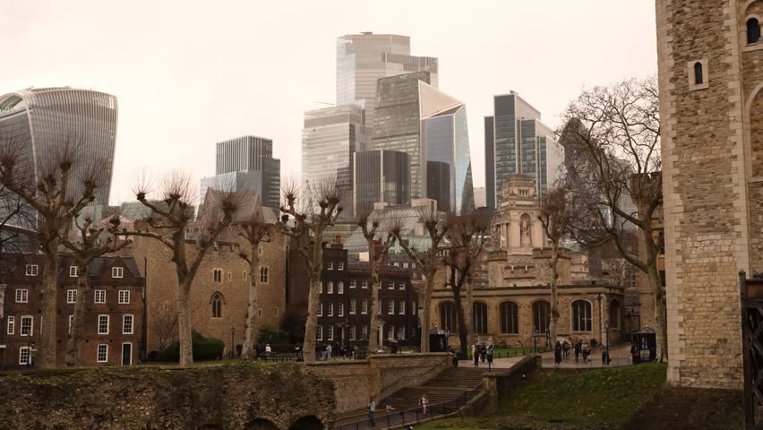 Expansive view of the City of London skyline featuring a blend of historic landmarks and contemporary skyscrapers under soft daylight. The shot captures the financial district’s dynamic architecture, including glass office towers and iconic high-rises, representing the economic core of the United Kingdom.