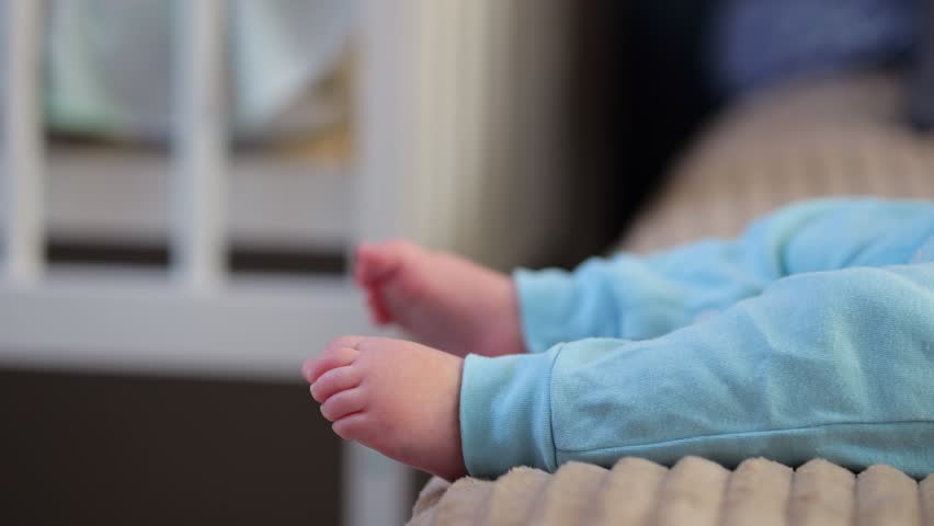 Gentle Image Capturing Infant Toes Peacefully Lying. Delicate Baby Toes Peacefully Nestled Beside Cozy Crib. Detailed View Showcasing Tiny Infant Toes Resting Calmly Amidst Soft Bedding Comfort
