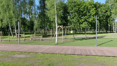 Drone Sliding Sideways across Forest Park Playground
