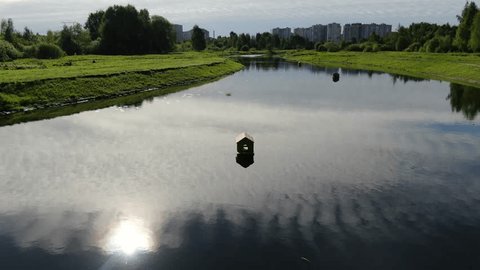Drone Flying Forward Tilting Down over Duck