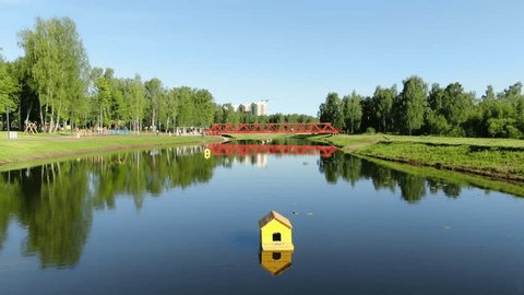 Low Drone Flight Forward along Calm Park