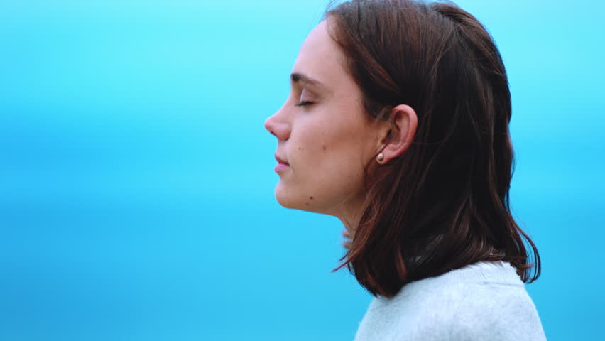Thinking, blue sky or woman outdoor with fresh air, past memory or mindfulness on weekend break. Windy, mockup space or female person with reflection, breathing or peaceful perspective in free time.