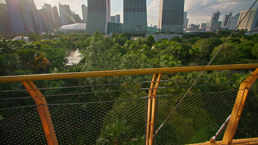 Gardens by the Bay view of Marina Bay Sands in Singapore. Urban cityscape at sunset, travel and tourism in Asia.