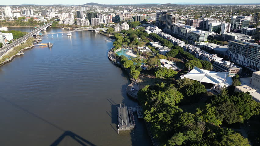 Brisbane Australia urban skyline with glass skyscrapers and business centers by the river, aerial perspective of contemporary city architecture