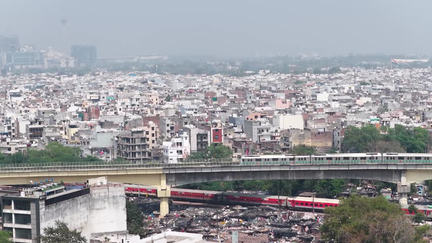 Aerial view of delhi metro with local train moving in new delhi, india 