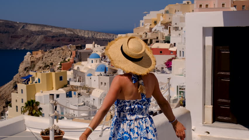 Woman beautiful in Greece Santorini. Selective focus.