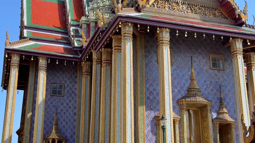 Ornate temple architecture in Grand Palace complex near Wat Phra Kaew in Bangkok, Thailand. Traditional Thai design, golden details and cultural landmark in Southeast Asia.