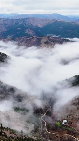 Vertical 1080p aerial footage of a fog-filled mountain valley with dramatic ridgelines and forest textures.
Perfect for social media reels, travel content, and cinematic vertical storytelling.