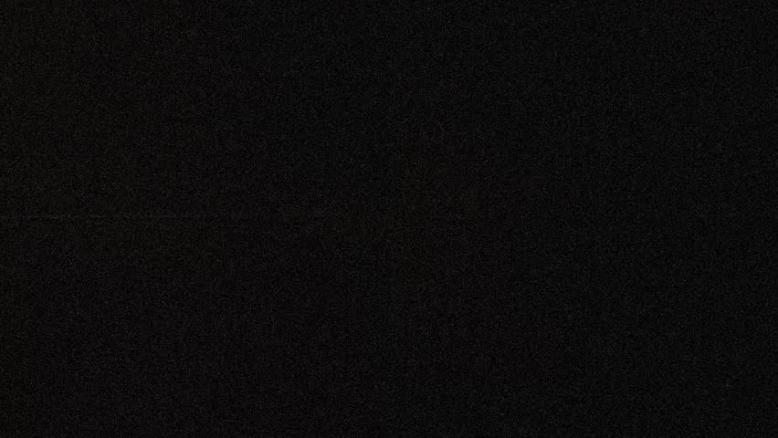 Dark folded paper background with cross creases and film grain. Vintage black crumpled parchment with organic dust, scratches . Horizontal 1080p Full HD.