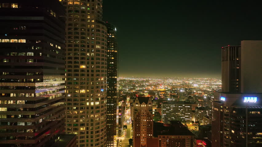 Los Angeles city night lights from drone. LA downtown timelapse. Los Angeles night aerial motion. Los Angeles city skyline at night. LA night cityscape video. Downtown Los Angeles lights.