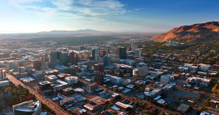 Modern urban landscape around the beautiful rocks. Neighborhoods of Salt Lake City, Utah, USA at sunset.