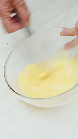 Preparing beaten eggs for an Italian omelette homemade food