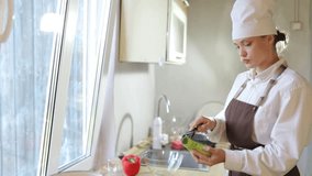 young female cook cooking in the kitchen at home - Powered by Shutterstock - Get 15% off with code: PIKWIZARD15