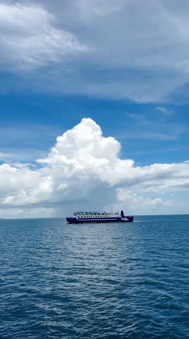Gliding across the turquoise waters of the Sunda Strait, our boat carried us from one volcanic island to the next, weaving through the legendary seascape that lies between Java and Sumatra - blurred background - defocused