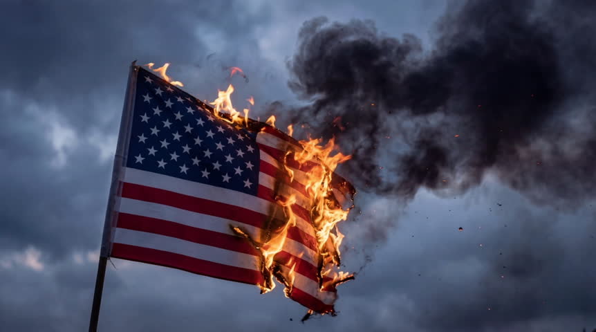 American flag burns fiercely against stormy skies. Smoke billows darkly into the gloomy atmosphere. Flames consume red, white, and blue with urgency. Emotion radiates anger, loss, or protest,seamless loop