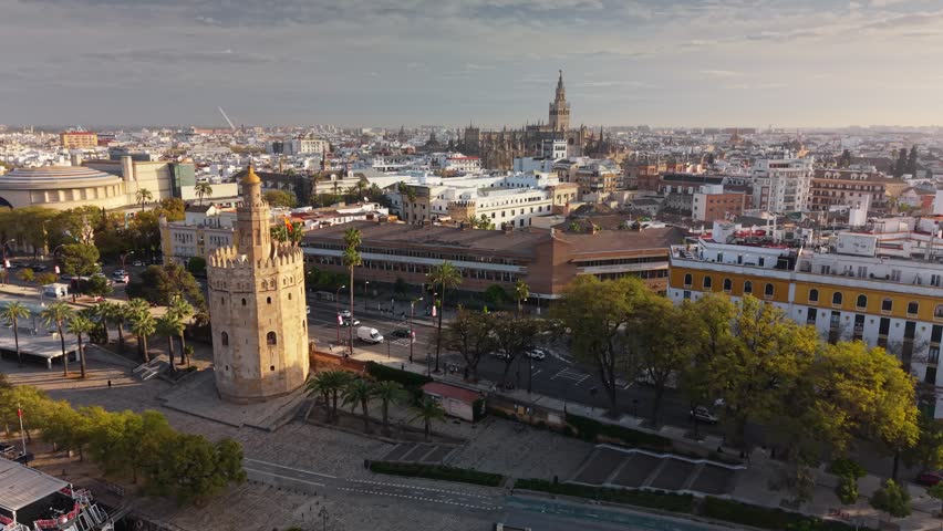 Aerial view of the Torre del Oro gold tower and Seville cityscape, historic landmark by the Guadalquivir river in Spain. Historic gold tower in Seville
