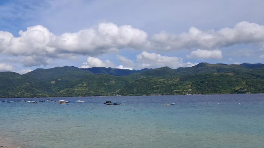 A serene bay view under a cloudy afternoon sky