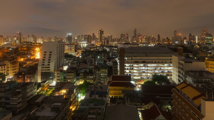 Timelapsing view of skyline with urban buildings in Bangkok, Thailand.