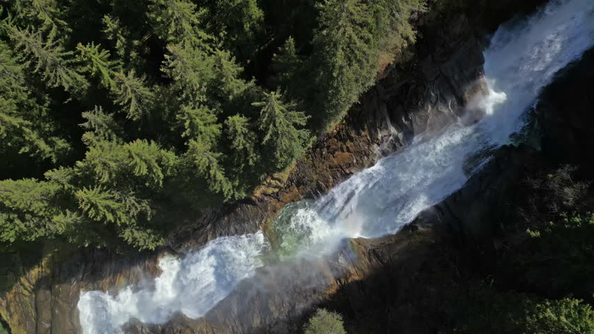 Aerial top view of Krimml Waterfalls in forest mountain. High Tauern National Park, Austrian Alps, Austria, 4k