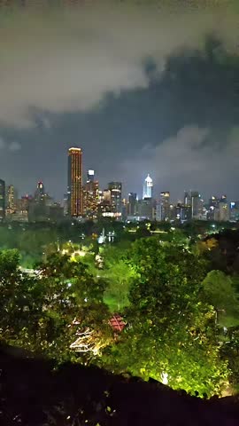 Nighttime Cityscape skyline of Bangkok, Thailand Capital City, Skyscraper Downtown, Urban Metropolitan, Panning Panorama Shot, Slow Motion