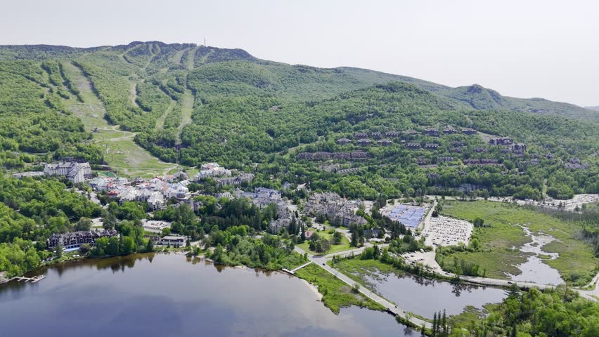 Aerial view of Mont Tremblant resort village, Quebec, Canada with lake, forest and mountain landscape in summer. g.